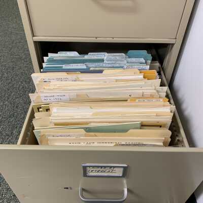 SLHS File Cabinet 2 - Drawer 4: Stores numerous full and partial extra copies the various calendars and house tour brochures and guides that SLHS has produced over the years.