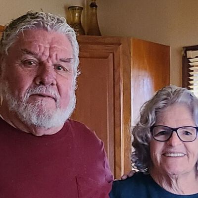Photo of David St Pierre and Sharron "Chick" Shepard: Taken in March of 2022.  David preserved these documents for over 30 years and Sharron eventually helped him donate them to the Town of Sand Lake.