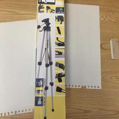 54 inch tall Ambico camera tripod: Only weighs 1.7 pounds, folds to about 20 inches tall, includes a top that twists, tilts, and rotates in almost any direction.  Stored in SLHS-FC5 D1.