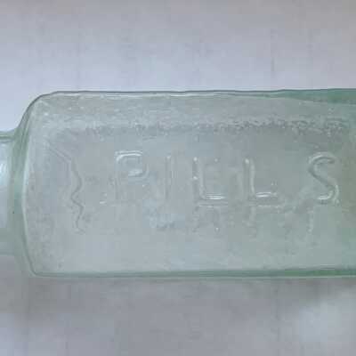 Dr. D. Evans Pill Bottle - Pills embossed side