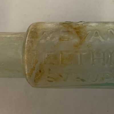 Dr. W. Evans Teething Syrup bottle: Likely a $5 to $10 value.  Would be $30 to $50 if in condition.  Dr. Evans marketed a wide range of medications to consumers throughout the Northeast.