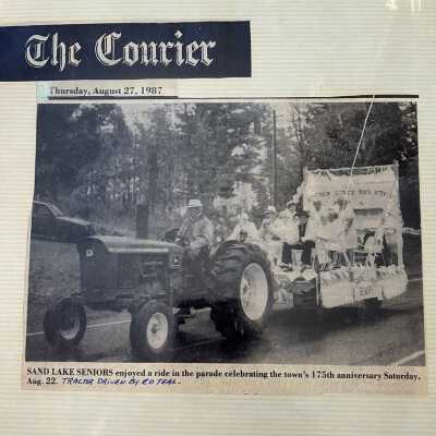 Sand Lake Seniors enjoyed a ride in the parade celebrating the town's 175th anniversary. The Courier, Aug 27, 1987