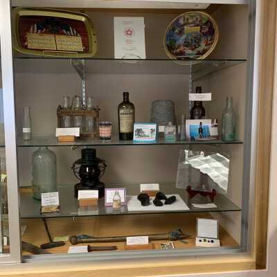 Various Artifacts and Photos Display - Right Side: Note the addition of the Burden Lake Casino Matchbook on the left side of the 3rd shelf.