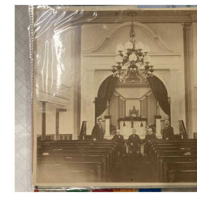 1883 Church Sanctuary Photograph: Two-page downloadable PDF of an 1883 photograph of (presumably from left to right) Fred Hack, Albert Fox, Reverend Milton M. Mills, John Miller, and John A. Coon seated and standing in the Sanctuary of the Sand Lake Baptist Church per a notation on the back.  The notation also notes that the Church once had an aisle down the center and straight seats.  Original photo is in the collection of the Sand Lake Batpist Chirch.