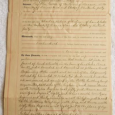 Doc # 47 Indenture 1903-05-01 FPO: Rosella Currie to Charles Holser. Deeds property located near FM from Currie to Holser. Also mentions Arnold H. Wade and Andrew B. Knowlson.