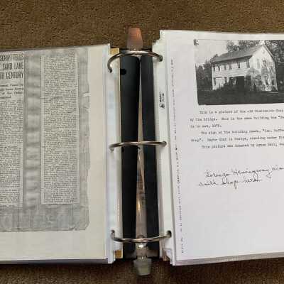 Left: Article regarding Julia F. Lester's discovery Dr. Eber W. Carmichael's manuscript of Sand Lake recollections of: Right:  George Hoffman Jr. and Lorenzo Hemingway blacksmith shop and Park Restaurant photo