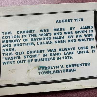 Raymond W. Nash Store Display Cabinet - Card in Cabinet: Information card stored inside the cabinet from the Nash Store formerly located in the historic structure situated across from the Cumberland Farms store at the corner of State Routes 66 and 43 in Averill Park in the Town of Sand Lake, NY.  Refer to the following URL if desired for a bit more information:  https://sandlakehistory.org/gas/index.html