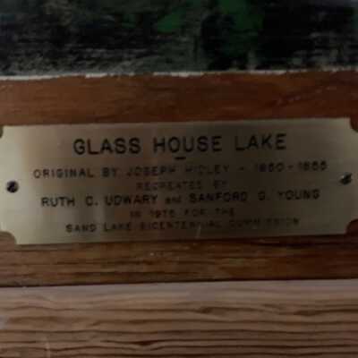 Glass House Lake painting - plate: Plate on the large scale recreation of Joseph Hidley's View of Glass Lake on plywood by Sanford G. Young and Ruth C. Udwary for the Town of Sand Lake Bicentennial