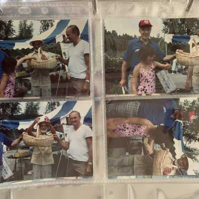 PB1 Page 27 - 1991 Tailgate Sale: Chet Gaurwyk, Irv Edwards and Ross French conduction a drawing for an antique clock.