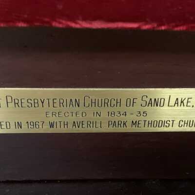Speaker's Podium / Lectern from the First Presbyterian Church of Sand Lake - Plaque: Lectern from the former church that formerly served as the Town Hall of the Town of Sand Lake and now serves as the home of the Sand Lake Center for the Arts. The First Presbyterian Church dated back to 1834 and united with the Averill Park Methodist Church in 1967.  The lectern is located in the Town Court area of Town Hall.