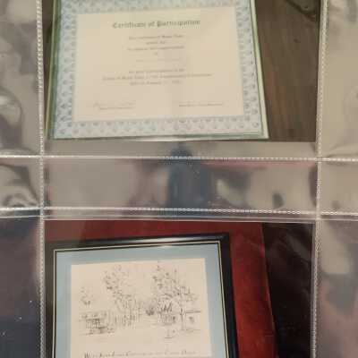 PB1 Page 56 - Christmas 1998: Top - Certificate of participation awarded to SLHS by the TOSL for supporting its 175th anniversary.
Bottom - Drawing of the West Sand Lake Corners in the early days.