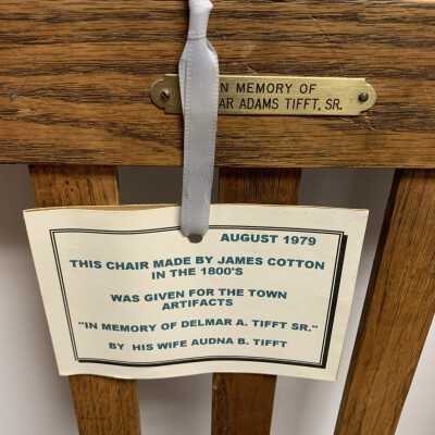 James C. Cotton Small Chair Set - Tag Example Close Up: One of the three identical tags attached to three matching small chairs made by James C. Cotton in the 1800s.  Refer to the following URL for additional information if desired https://sandlakehistory.org/cottonhs.htm