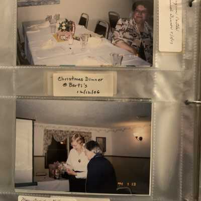 PB3 Page 27 - Annual Dinner May 2007: Top - Mary Ann Castle.  
Bottom - Mary French and Kitty Mace admiring a corn husk doll holding a Sand Lake book.  Gift to co-author French for work on Sand Lake book.