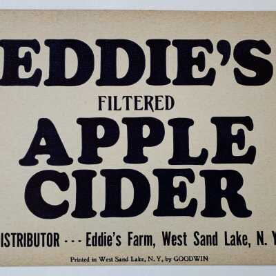Eddie's Apple Cider Poster: Two SLHS owned signs that are stored in pocket protector #12 of the SLHS Miscellaneous Ephemera and Artifacts Binder that is stored in the 2nd Drawer of SLHS File Cabinet 1 on the second floor of Town Hall.