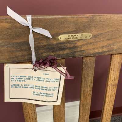 James C. Cotton Rockers - Tag Example Close Up: Set of two matching rocking chairs made by James C. Cotton in the 1800s.  Refer to the following URL for additional information if desired https://sandlakehistory.org/cottonhs.htm