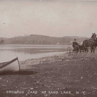 Crooked Lake, Sand Lake, NY: Crooked Lake, Sand Lake, NY, postcard.  Boat and horse and buggy.