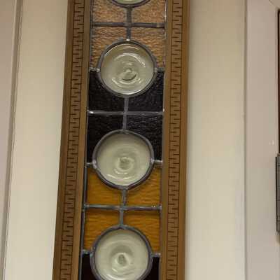 Stained Glass Window - 2 of 2 identical Windows. Right Side: Origin Unknown.  Currently hanging on the wall in the Courtroom of Town Hall.