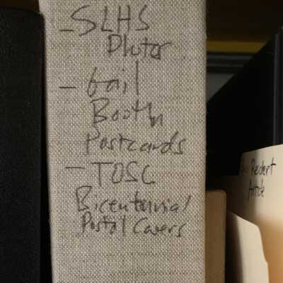 The page protector storing the Gail Booth collection is further stored in this binder.: The page protector storing the Gail Booth collection is further stored in this binder.