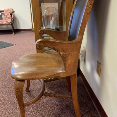 James K. Averill Law Office Chair – Side: Chair from the Law Office of James K. Averill donated to the Town of Sand Lake by descendant Donald Averill Howard on June 13, 1982.  The following URL provides additional details about J. K. Averill as desired  https://sandlakehistory.org/averill.htm