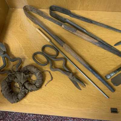 Miscellaneous Glass Making Tools - Left Side Close Up: Collection of glass making shears, crimpers, tweezers, and jacks.  Refer to the following Corning Glass web site for additional information:  https://www.cmog.org/article/tools-glassmaker