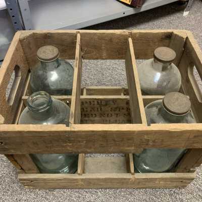 Six Sand Lake Springs 5 Pint Water Bottles and Returnable Bottles Container - Box Type 1, View 3: Four Sand Lake Springs 5 Pint Water Bottles and Returnable Bottles Container / Caddy - Box Type 1, View 3.  2 bottles temporarily removed to allow for inside view of box.