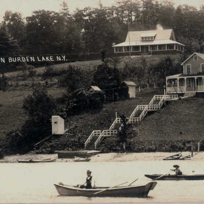 View on Burden Lake, NY: View on Burden Lake, NY, postcard.  Includes boats and a view of cottages from the water. 