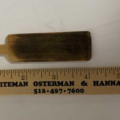Glass Making Paddle - Small with Scale: A paddle is a wooden board with handle used for flattening glass, particularly the base or foot of a vessel. A paddle becomes charred with use against hot glass. Occasionally, a glassmaker’s assistant will protect the glassmaker from excess radiant heat by using the paddle as a shield.