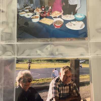 PB1 Page 57: Top - The food Christmas 1998.
Bottom - Marion Hacker and Ross French at a picnic meeting.  Year?  Not specified.