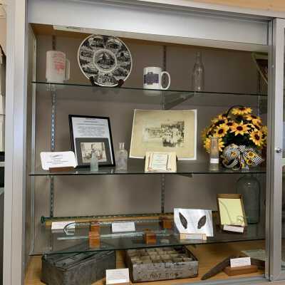 Various Artifacts and Photos Display - Left Side: Various Artifacts and Photos Display - Left Side