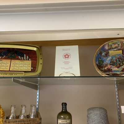 Various Artifacts and Photos Display - Right Side Close Up Top Shelf: Various Artifacts and Photos Display - Left Side Close Up Top Shelf.  Includes a Town of Sand Lake US Bicentennial celebration program and commemorative items.