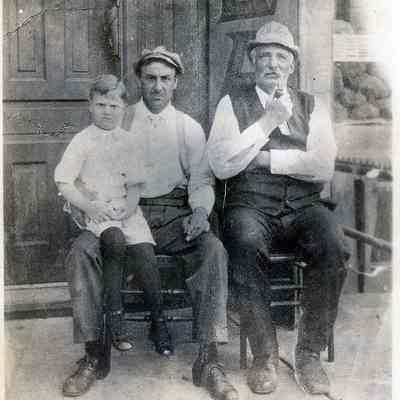 Men in chairs outside 2515 W Fullerton