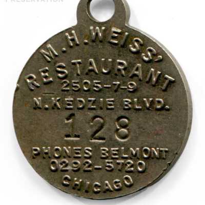 M.H. Weiss' Restaurant Upside-Down Face Charm: Reverse of charm