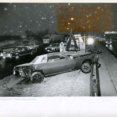 Tow truck prepares to remove an auto that crashed