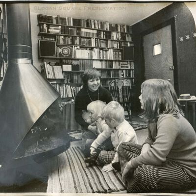 Hedvig Meister and kids around living room fireplace