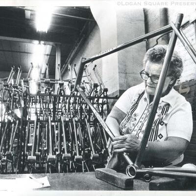 Dolly Becker aligns the decals on a Schwinn Varsity bike