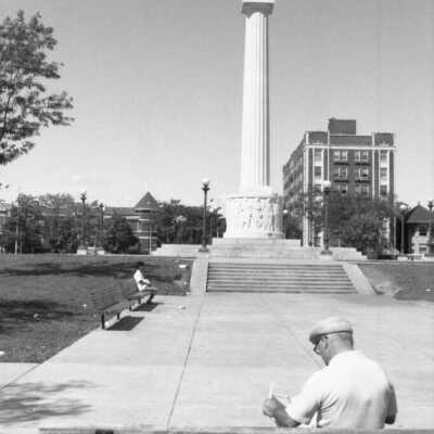 Man Reading at Centennial Monument - Aug 11, 1985