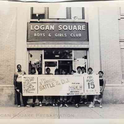 Boys & Girls Club Members holding Battle Banner