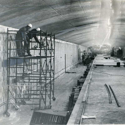 Brick work being done on walls of giant Logan Square-Spaulding station