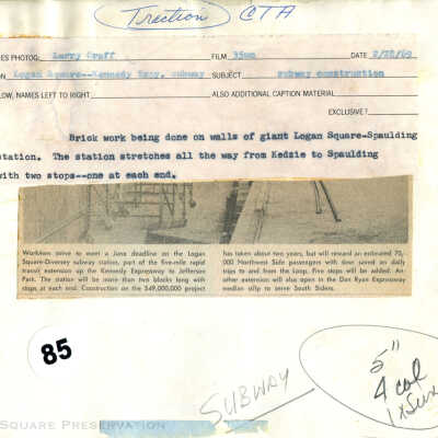 Brick work being done on walls of giant Logan Square-Spaulding station: Back of photograph