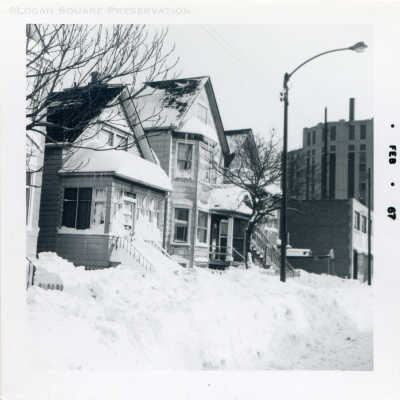 Snow covered houses on Diversey Ave