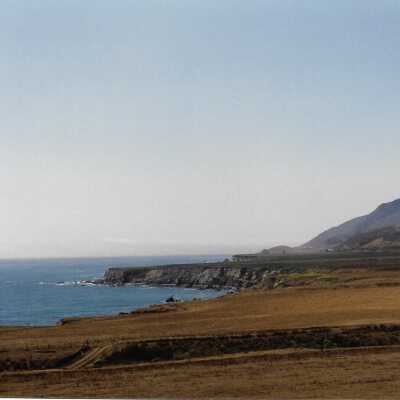 View from Pecho Coast Trail above Port San Luis Pier, The Nature Conservancy hike, in photo album from Joyce Hall - Undated 3.5" x 5" color photograph