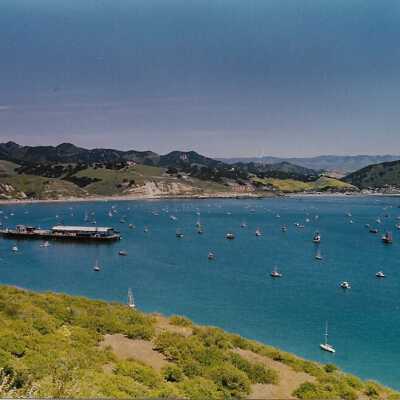 Port San Luis Pier from Pecho Coast Trail, The Nature Conservancy hike, in photo album from Joyce Hall - Undated 3.5" x 5" color photograph