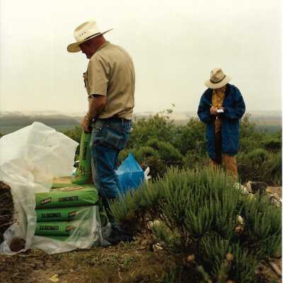Pictures of the construction sequence of the monumnet on Coreopsis Hill for Joseph Enos and Mary Barcellos Enos for allowing people to lead hikers on their propertyto see the beautiful dune flowers, monument idea by Kathleen Goddard Jones, designed and constructed by Jack Beigle, Al Spierling, Norm Hammond, and Hal Shartz with Kathleen Goddard Jones supervising, 1994 - 4" x 4" color photograph