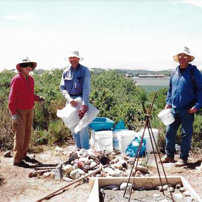 Pictures of the construction sequence of the monumnet on Coreopsis Hill for Joseph Enos and Mary Barcellos Enos for allowing people to lead hikers on their propertyto see the beautiful dune flowers, monument idea by Kathleen Goddard Jones, designed and constructed by Jack Beigle, Al Spierling, Norm Hammond, and Hal Shartz with Kathleen Goddard Jones supervising, 1994 - 3.5" x 5" color photograph