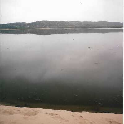 Sand, water, hills, February 1995 - 4" x 6" color photograph