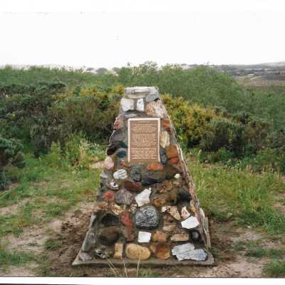 The completed monumnet on Coreopsis Hill for Joseph Enos and Mary Barcellos Enos for allowing people to lead hikers on their propertyto see the beautiful dune flowers, monument idea by Kathleen Goddard Jones, designed and constructed by Jack Beigle, Al Spierling, Norm Hammond, and Hal Shartz with Kathleen Goddard Jones supervising, 1994 - 3.5" x 5.5" color photograph
