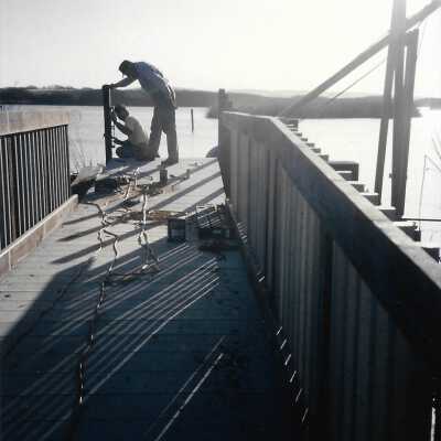 Construction of boardwalk over Oso Flaco Lake, 1994 - 3.5" x 5" color photograph