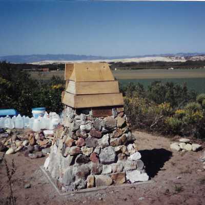 The completed monumnet on Coreopsis Hill for Joseph Enos and Mary Barcellos Enos for allowing people to lead hikers on their propertyto see the beautiful dune flowers, monument idea by Kathleen Goddard Jones, designed and constructed by Jack Beigle, Al Spierling, Norm Hammond, and Hal Shartz with Kathleen Goddard Jones supervising, 1994 - 3.5" x 5" color photograph