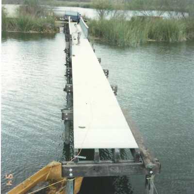 Construction of boardwalk over Oso Flaco Lake, 1994 - 3.5" x 5" color photograph