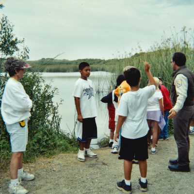 Chris Barr US Fish and Wildlife Service with an unspecified Elementary School Field Trip 2001; 4" x 6" color photograph